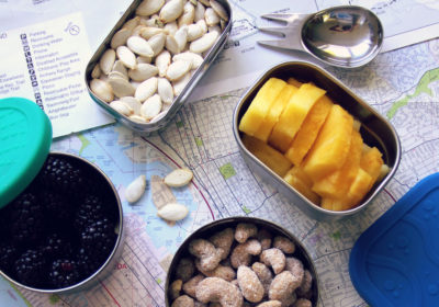 personal chef while traveling - snacks in travel containers on a map