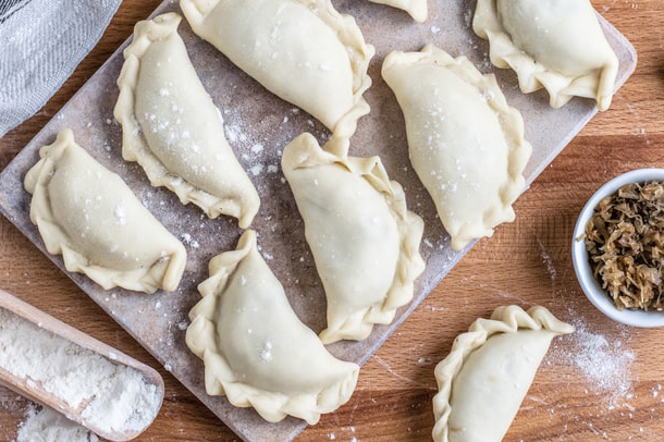 cooking classes empanadas not cooked on a wooden board